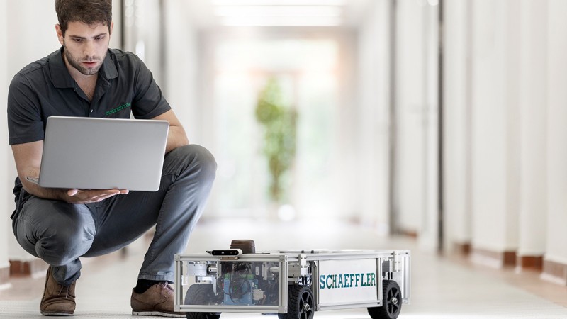 A student at the Karlsruhe Institute of Technology (KIT) programming the